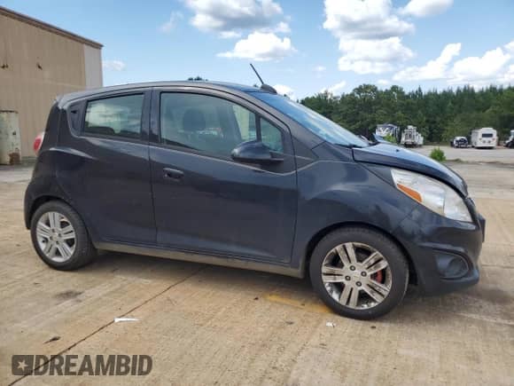 2015 Chevrolet Spark LS with VIN KL8CB6S90FC803204, listed as a Copart auction lot 69191245 with 126,559 mi miles and Salvage title. Bid and sale history available at DreamBid. Image 4.