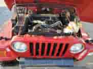 2000 Jeep Wrangler Sport z VIN 1J4FA49SXYP768858, wystawiony jako Copart lot #72104145 z przebiegiem 228 361 mil mil oraz Szkoda całkowita • Salvage title. Historia ofert i sprzedaży dostępna na DreamBid. Obrazek 12.