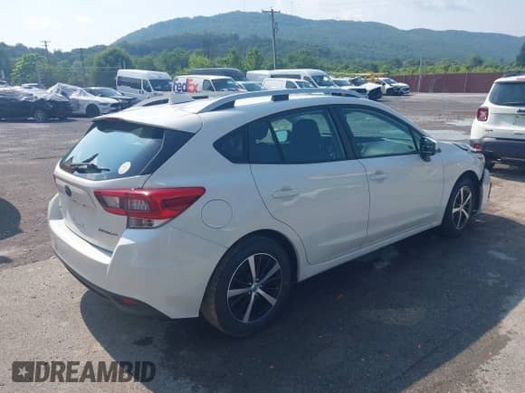 2021 Subaru Impreza Premium with VIN 4S3GTAD68M3716546, listed as a IAAI auction lot 42469234 with 55,450 mi miles and . Bid and sale history available at DreamBid. Image 4.