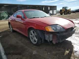 2003 Hyundai Tiburon GT с VIN KMHHN65FX3U078623, выставлен на аукционе Copart как лот 42570475 с пробегом 196 426 миль миль и Списание • Salvage title. История ставок и продаж доступна на DreamBid. Изображение 4.