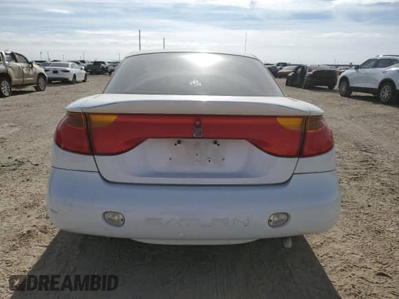 2002 Saturn SC with VIN 1G8ZY12772Z164242, listed as a Copart auction lot 46911695 with 216,124 mi miles and Salvage title. Bid and sale history available at DreamBid. Image 6.