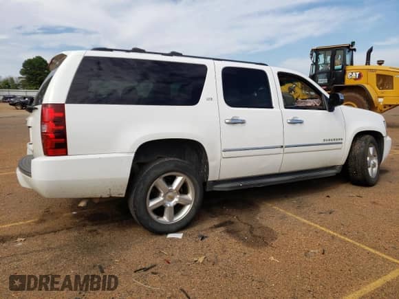 2013 Chevrolet Suburban LTZ с VIN 1GNSKKE7XDR270897, выставлен на аукционе Copart как лот 82593994 с пробегом 89 975 миль миль и Списание • Salvage title. История ставок и продаж доступна на DreamBid. Изображение 3.