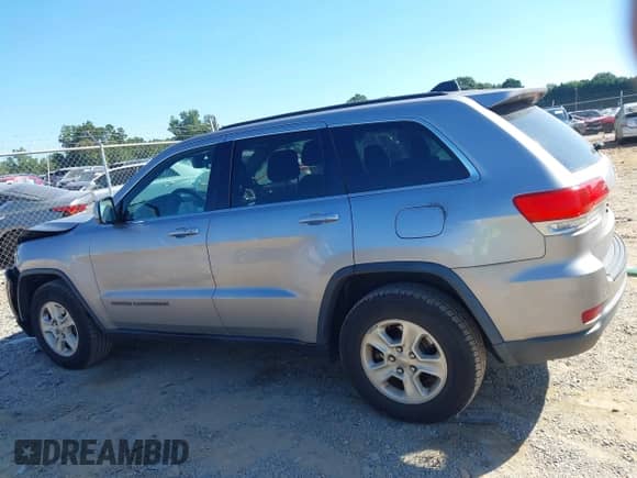 2017 Jeep Grand Cherokee Laredo with VIN 1C4RJEAGXHC671814, listed as a IAAI auction lot 43097972 with 165,240 mi miles and . Bid and sale history available at DreamBid. Image 14.