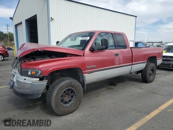 1999 Dodge 2500 with VIN 3B7KF2369XG173993, listed as a Copart auction lot 71192525 with 213,711 mi miles and Salvage title. Bid and sale history available at DreamBid. Image 1.