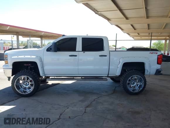 2014 Chevrolet Silverado 1500 LT z VIN 3GCUKREC8EG257977, wystawiony jako IAAI lot #42699776 z przebiegiem 132 224 mil mil oraz . Historia ofert i sprzedaży dostępna na DreamBid. Obrazek 14.
