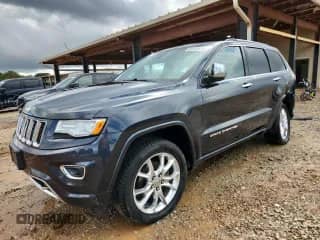2015 Jeep Grand Cherokee Overland with VIN 1C4RJFCG9FC633703, listed as a Copart auction lot 83843635 with 143,016 mi miles and Salvage title. Bid and sale history available at DreamBid. Image 1.