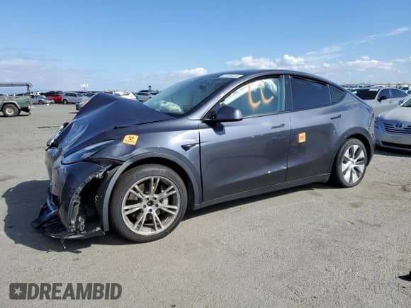 2022 Tesla Model Y Long Range with VIN 7SAYGAEE2NF345566, listed as a Copart auction lot 81694405 with Not provided miles and Salvage title. Bid and sale history available at DreamBid. Image 1.