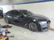 2018 BMW 5 Series M550i xDrive with VIN WBAJB9C54JB286660, listed as a Copart auction lot 62594805 with 137,794 mi miles and Salvage title. Bid and sale history available at DreamBid. Image 4.