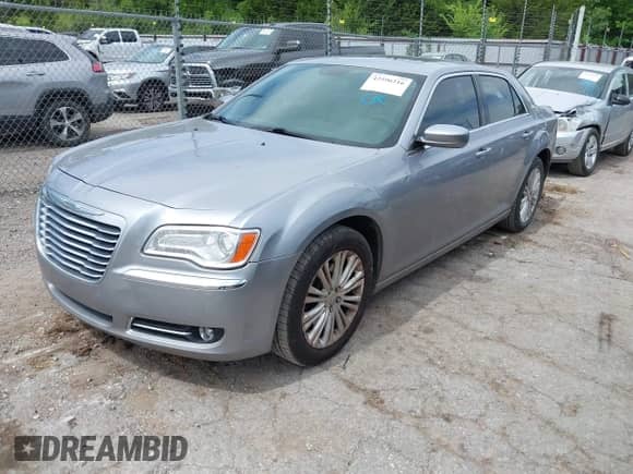2014 Chrysler 300 with VIN 2C3CCARG7EH163424, listed as a IAAI auction lot 42596216 with 132,943 mi miles and . Bid and sale history available at DreamBid. Image 2.