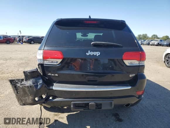 2018 Jeep Grand Cherokee Overland with VIN 1C4RJFCG5JC263987, listed as a Copart auction lot 81916125 with 87,504 mi miles and Salvage title. Bid and sale history available at DreamBid. Image 6.