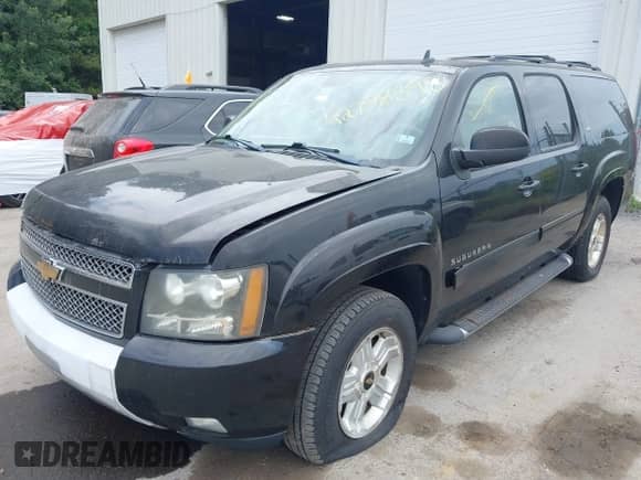2011 Chevrolet Suburban LT z VIN 1GNSKJE31BR233032, wystawiony jako IAAI lot #42758398 z przebiegiem 167 514 mil mil oraz . Historia ofert i sprzedaży dostępna na DreamBid. Obrazek 2.
