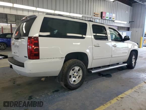 2012 Chevrolet Suburban LS with VIN 1GNSCHE01CR282471, listed as a Copart auction lot 70658295 with Not provided miles and Salvage title. Bid and sale history available at DreamBid. Image 3.