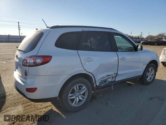 2012 Hyundai Santa Fe GLS с VIN 5XYZGDAG7CG156198, выставлен на аукционе Copart как лот 89409405 с пробегом 122 609 миль миль и Списание • Salvage title. История ставок и продаж доступна на DreamBid. Изображение 3.