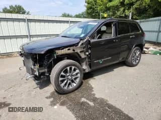 2017 Jeep Grand Cherokee Overland with VIN 1C4RJECG1HC659385, listed as a Copart auction lot 82172205 with 67,873 mi miles and Salvage title. Bid and sale history available at DreamBid. Image 1.