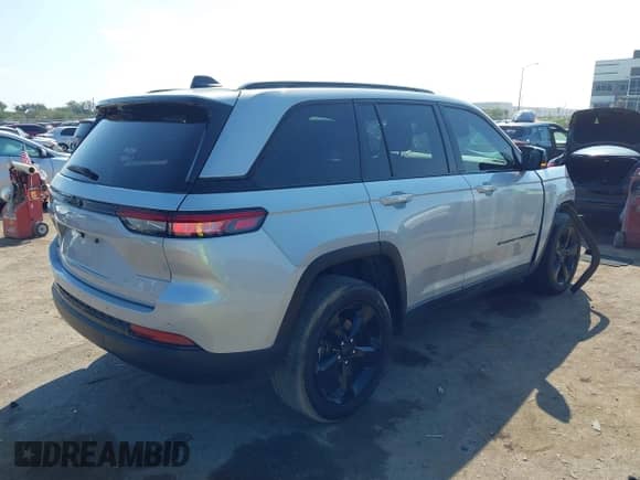 2023 Jeep Grand Cherokee Laredo with VIN 1C4RJHAG5PC659828, listed as a IAAI auction lot 43418211 with 27,942 mi miles and . Bid and sale history available at DreamBid. Image 4.