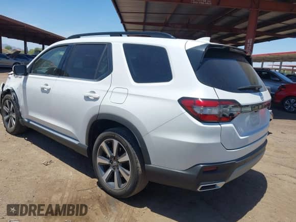 2023 Honda Pilot Touring с VIN 5FNYG2H70PB002497, выставлен на аукционе IAAI как лот 42676885 с пробегом 33 829 миль миль и . История ставок и продаж доступна на DreamBid. Изображение 3.