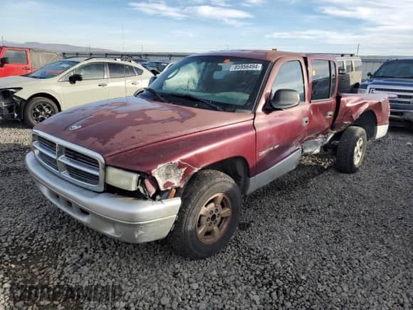 2002 Dodge Dakota SLT with VIN 1B7HL48N52S525130, listed as a Copart auction lot 85956494 with 220,368 mi miles and Salvage title. Bid and sale history available at DreamBid. Image 1.