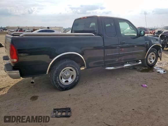 1999 Ford F-150 with VIN 1FTRX17W3XNB91574, listed as a Copart auction lot 84773145 with Not provided miles and Salvage title. Bid and sale history available at DreamBid. Image 3.