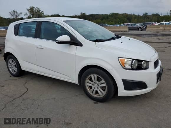 2015 Chevrolet Sonic LT with VIN 1G1JC6SH7F4154586, listed as a Copart auction lot 83948665 with 46,146 mi miles and Salvage title. Bid and sale history available at DreamBid. Image 4.