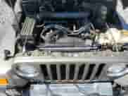 2006 Jeep Wrangler SE z VIN 1J4FA29S06P701557, wystawiony jako Copart lot #68312385 z przebiegiem 117 383 mil mil oraz Szkoda całkowita • Salvage title. Historia ofert i sprzedaży dostępna na DreamBid. Obrazek 11.