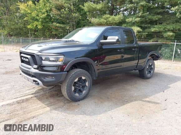 2019 Ram 1500 Rebel z VIN 1C6SRFET2KN705108, wystawiony jako IAAI lot #43163417 z przebiegiem 110 932 mil mil oraz . Historia ofert i sprzedaży dostępna na DreamBid. Obrazek 22.