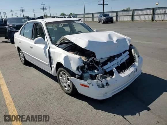 2003 Hyundai Accent GL z VIN KMHCG45C73U427901, wystawiony jako Copart lot #63874575 z przebiegiem 134 268 mil mil oraz Szkoda całkowita • Salvage title. Historia ofert i sprzedaży dostępna na DreamBid. Obrazek 13.