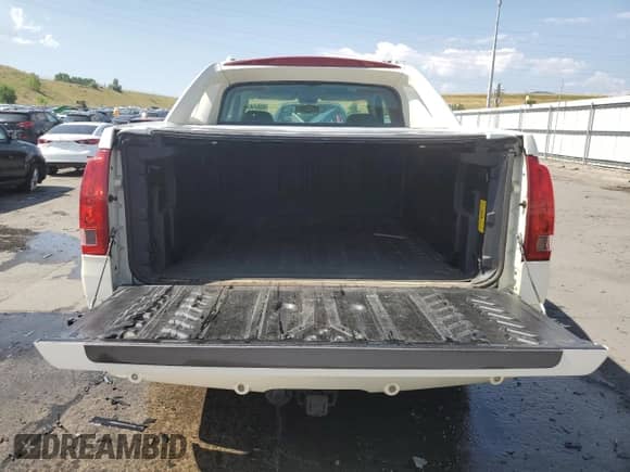 2002 Cadillac Escalade EXT with VIN 3GYEK63N62G352535, listed as a Copart auction lot 65949854 with 174,828 mi miles and Salvage title. Bid and sale history available at DreamBid. Image 6.