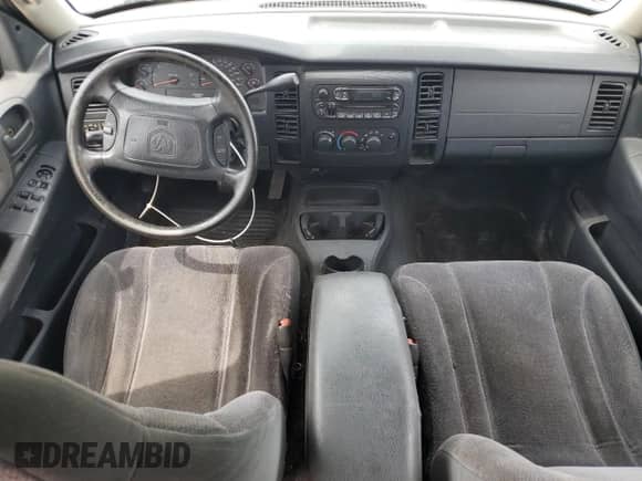 2002 Dodge Dakota Sport z VIN 1B7HL38X12S640531, wystawiony jako Copart lot #81258775 z przebiegiem 210 552 mil mil oraz Szkoda całkowita • Salvage title. Historia ofert i sprzedaży dostępna na DreamBid. Obrazek 8.