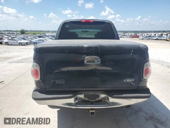 2002 Ford F-150 XLT с VIN 1FTRW07L22KB04146, выставлен на аукционе Copart как лот 69320515 с пробегом 189 839 миль миль и Списание • Salvage title. История ставок и продаж доступна на DreamBid. Изображение 6.