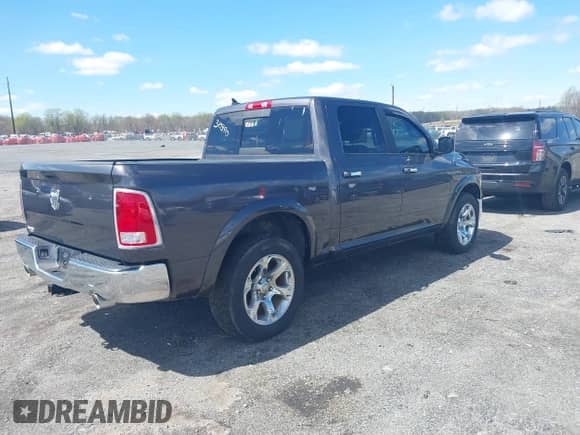 2018 Ram 1500 Laramie with VIN 1C6RR7NM0JS310390, listed as a IAAI auction lot 41997909 with 135,051 mi miles and . Bid and sale history available at DreamBid. Image 4.