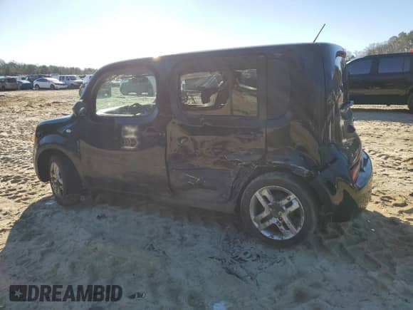 2011 Nissan Cube SL с VIN JN8AZ2KR0BT204675, выставлен на аукционе Copart как лот 85798754 с пробегом 215 611 миль миль и Списание • Salvage title. История ставок и продаж доступна на DreamBid. Изображение 2.