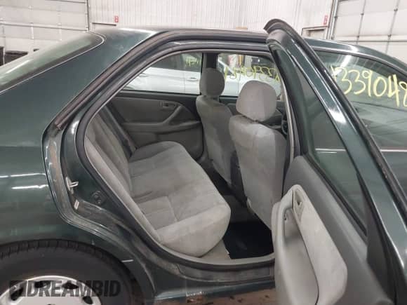 1999 Toyota Camry LE z VIN 4T1BG22KXXU900658, wystawiony jako IAAI lot #43390481 z przebiegiem 268 548 mil mil oraz . Historia ofert i sprzedaży dostępna na DreamBid. Obrazek 8.