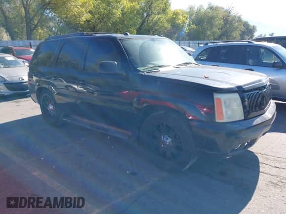 2004 Cadillac Escalade z VIN 1GYEK63N34R100972, wystawiony jako IAAI lot #43374595 z przebiegiem 210 527 mil mil oraz . Historia ofert i sprzedaży dostępna na DreamBid. Obrazek 1.