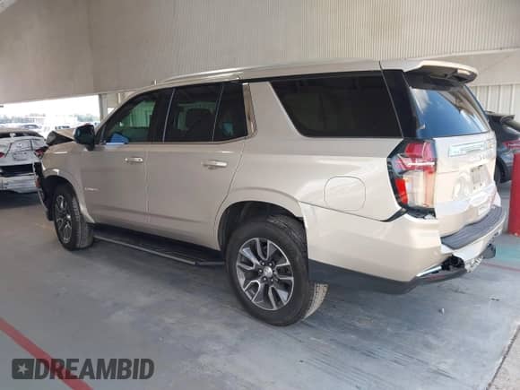 2021 Chevrolet Tahoe LT z VIN 1GNSCNKD0MR410612, wystawiony jako IAAI lot #43081370 z przebiegiem 144 805 mil mil oraz . Historia ofert i sprzedaży dostępna na DreamBid. Obrazek 3.