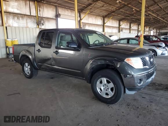 2007 Nissan Frontier SE with VIN 1N6AD07U67C431739, listed as a Copart auction lot 86591175 with 131,668 mi miles and Salvage title. Bid and sale history available at DreamBid. Image 4.