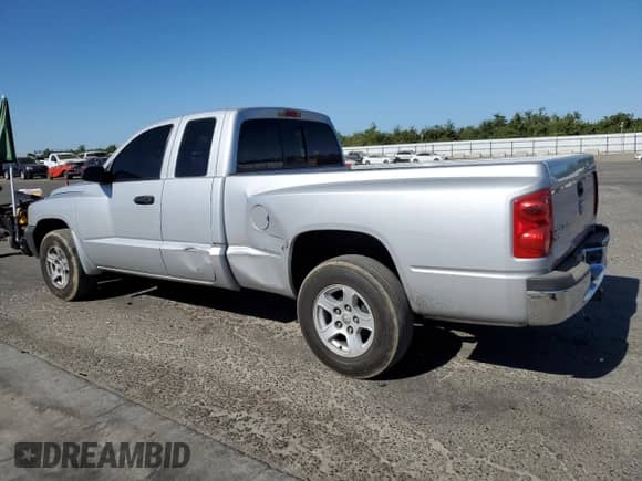2005 Dodge Dakota SLT с VIN 1D7HE42K65S163019, выставлен на аукционе Copart как лот 67673975 с пробегом 118 096 миль миль и Списание • Salvage title. История ставок и продаж доступна на DreamBid. Изображение 2.