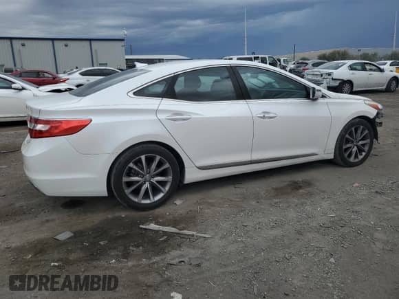 2016 Hyundai Azera z VIN KMHFG4JG1GA501648, wystawiony jako Copart lot #84999475 z przebiegiem 99 854 mil mil oraz Szkoda całkowita • Salvage title. Historia ofert i sprzedaży dostępna na DreamBid. Obrazek 3.