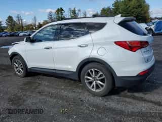 2015 Hyundai Santa Fe z VIN 5XYZUDLA4FG261139, wystawiony jako Copart lot #86995445 z przebiegiem 90 078 mil mil oraz Szkoda całkowita • Salvage title. Historia ofert i sprzedaży dostępna na DreamBid. Obrazek 2.