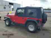 1999 Jeep Wrangler SE with VIN 1J4FY29P8XP404013, listed as a Copart auction lot 69127725 with 137,930 mi miles and Salvage title. Bid and sale history available at DreamBid. Image 2.