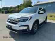 2022 Honda Pilot EX-L with VIN 5FNYF6H50NB018186, listed as a Copart auction lot 80308255 with 147,297 mi miles and Clean title. Bid and sale history available at DreamBid. Image 2.