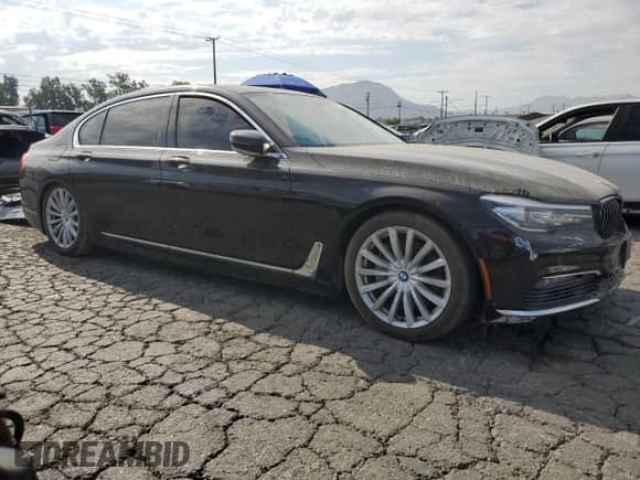 2016 BMW 7 Series 740i with VIN WBA7E2C58GG714590, listed as a Copart auction lot 65258235 with 118,840 mi miles and Clean title. Bid and sale history available at DreamBid. Image 4.