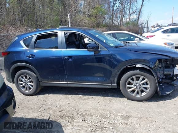 2022 Mazda CX-5 S Select z VIN JM3KFBBM8N0633363, wystawiony jako IAAI lot #42064278 z przebiegiem 69 226 mil mil oraz . Historia ofert i sprzedaży dostępna na DreamBid. Obrazek 14.