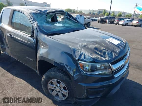 2019 Chevrolet Colorado 2WD Work Truck with VIN 1GCHSBEA2K1123712, listed as a IAAI auction lot 42928337 with 82,883 mi miles and . Bid and sale history available at DreamBid. Image 1.