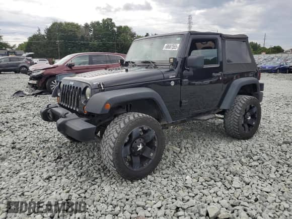 2013 Jeep Wrangler Rubicon z VIN 1C4BJWCG1DL584611, wystawiony jako Copart lot #68687555 z przebiegiem 143 063 mil mil oraz Szkoda całkowita • Salvage title. Historia ofert i sprzedaży dostępna na DreamBid. Obrazek 1.