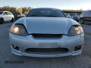 2005 Hyundai Tiburon GT с VIN KMHHN65F05U171038, выставлен на аукционе Copart как лот 87765735 с пробегом 113 129 миль миль и Списание • Salvage title. История ставок и продаж доступна на DreamBid. Изображение 5.