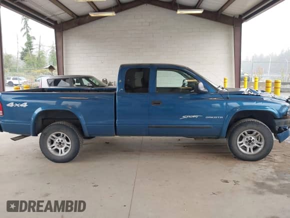 2004 Dodge Dakota Sport with VIN 1D7HG32N14S574163, listed as a IAAI auction lot 42381943 with 153,773 mi miles and . Bid and sale history available at DreamBid. Image 13.