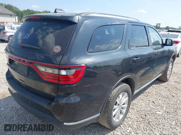 2015 Dodge Durango SXT with VIN 1C4RDJAG9FC938535, listed as a IAAI auction lot 43006107 with 74,658 mi miles and . Bid and sale history available at DreamBid. Image 4.