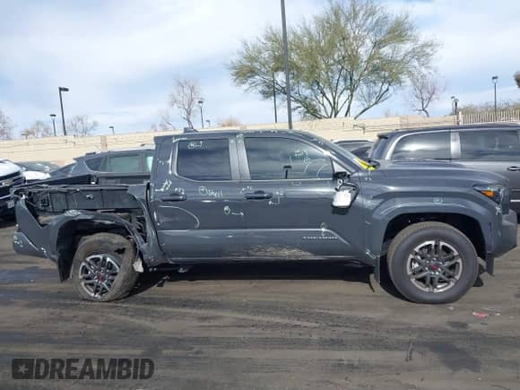 2024 Toyota Tacoma SR5 with VIN 3TMLB5JN5RM051339, listed as a IAAI auction lot 41241754 with 7,181 mi miles and . Bid and sale history available at DreamBid. Image 14.