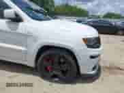 2014 Jeep Grand Cherokee SRT-8 z VIN 1C4RJFDJXEC450402, wystawiony jako IAAI lot #42705334 z przebiegiem 67 372 mil mil oraz . Historia ofert i sprzedaży dostępna na DreamBid. Obrazek 6.