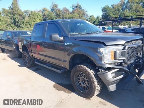 2020 Ford F-150 XLT with VIN 1FTEW1E53LFC30261, listed as a IAAI auction lot 43365752 with 125,373 mi miles and . Bid and sale history available at DreamBid. Image 1.